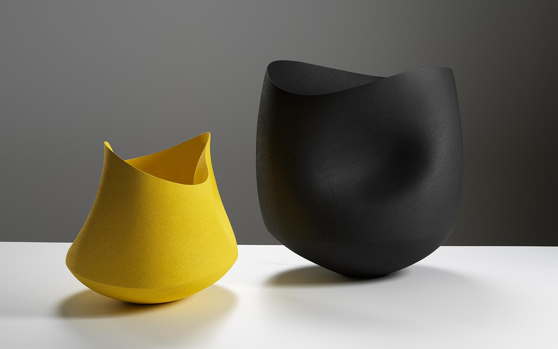 Two undulating bowls